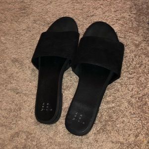 Black slide sandals with velvet texture
